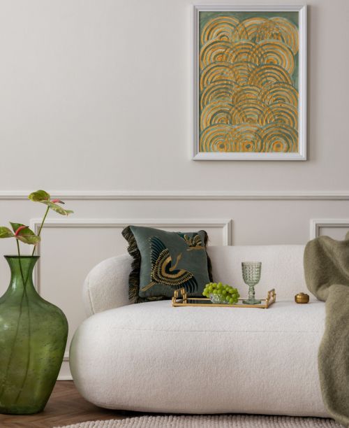 Living room interior with mock up poster frame, beige sofa, green pillow, plaid, glass vase with flowers, wall with stucco, round rug and personal accessories. Home decor. Template.